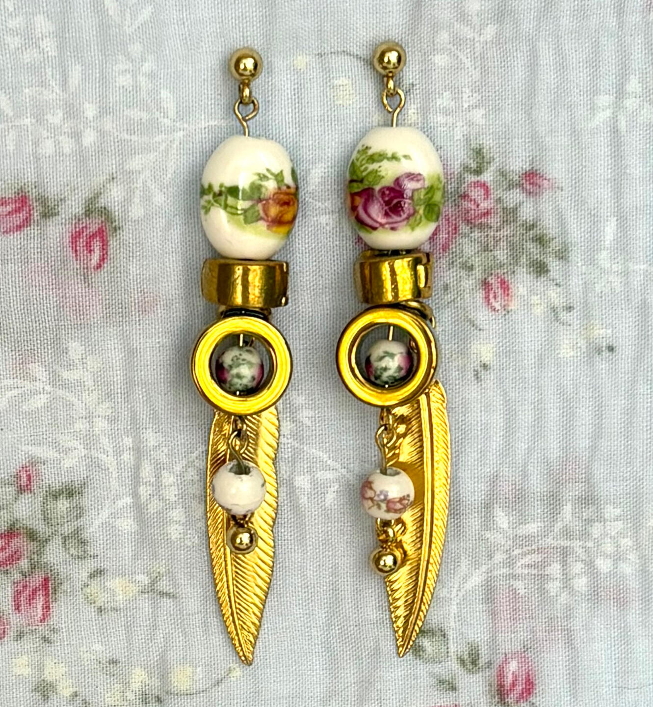 this earring pair is inspired by modern-day aristocracy; decadence that was once deemed unachievable. constructed using stainless steel + gold plated hardware, and porcelain beads.